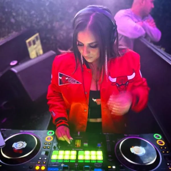DJ Miss Bhalla performing at the DJ decks
